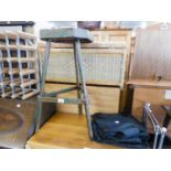 OCCASIONAL TABLE ON THREE LEGS, A WOOD AND METAL WINE RACK AND A FABRIC STORE UNIT (3)