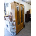 A MODERN LIGHT OAK TALL DISPLAY CABINET WITH TWO GLAZED DOORS, 3' WIDE