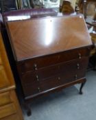 A MAHOGANY BUREAU WITH SLOPING FALL-FRONT, THREE LONG DRAWERS BELOW, ON CABRIOLE LEGS