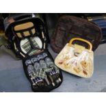 A CANVAS RUCKSACK FITTED PICNIC SET WITH BOTTLE HOLDER, AN EXPANDABLE HOLDALL ON WHEELS AND A