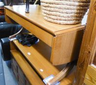 A NATHAN TEAK OBLONG COFFEE TABLE WITH FALL ENDS