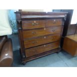 A LARGE VICTORIAN MAHOGANY CHEST OF TWO SHORT AND THREE LONG DRAWERS AND A LONG SECRET DRAWER ABOVE,