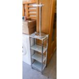 BRIGHT STEEL FRAMED WHAT-NOT WITH FOUR GLASS SQUARE SHELVES AND BRIGHT METAL TOILET ROLL PEDESTAL