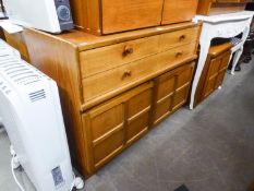 NATHAN, TEAK SIDEBOARD WITH STEPPED TOP, HAVING A NEST OF FOUR SHORT DRAWERS OVER A BASE WITH TWO