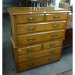 AN EARLY TWENTIETH CENTURY WALNUT TWO-PART TALLBOY CHEST OF FOUR SHORT AND FOUR LONG DRAWERS