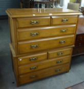 AN EARLY TWENTIETH CENTURY WALNUT TWO-PART TALLBOY CHEST OF FOUR SHORT AND FOUR LONG DRAWERS