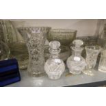 A LARGE COLLECTION OF CUT AND MOULDED GLASSWARES TO INCLUDE; BOWLS, VASES, DECANTERS ETC.....