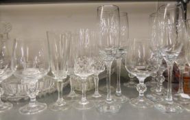 QUANTITY OF CUT AND PLAIN WINE GLASES TO INCLUDE; TWO DECANTERS AND A WINE JUG WITH PLATED HANDLE