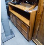 A NATHAN, TEAK SIDE UNIT, ONE OPEN COMPARTMENT OVER A CUPBOARD BASE, ENCLOSED BY TWO FOUR PANEL