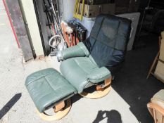 A STRESSLESS RECLINING GREEN LEATHER ARMCHAIR WITH MATCHING STOOL (2)
