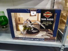 A HARLEY-DAVIDSON 'TANK RADIO' AM-FM RADIO WITH HEAD LIGHT AND ENGINE SOUND