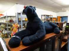 A LARGE STUFFED BLACK PANTHER TOY