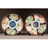 A PAIR OF JAPANANESE MEIJI PERIOD IMARI PORCELAIN SCALLOPED SAUCER DISHES, typically decorated in