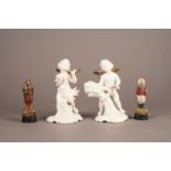 PAIR OF DRESDEN WHITE GLAZED PORCELAIN FIGURES OF PUTTI, ALLEGORICAL OF THE SEASONS, heightened in