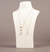 9K GOLD FINE CHAIN NECKLACE AND PENDANT set with a single pearl and a small diamond and a GOLD