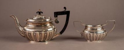 LATE VICTORIAN EMBOSSED SILVER BACHELOR?S TEAPOT AND TWO HANDLED SUGAR BASIN, each of rounded