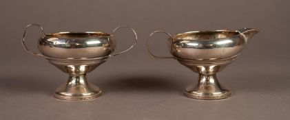 WEIGHTED STERLING SILVER PEDESTAL SUGAR AND CREAM SET, each with moulded girdle, loop handle and