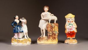 NINETEENTH CENTURY STAFFORDSHIRE PEN HOLDER GROUP, modelled as a man standing beside a goat, on a