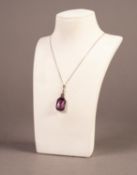 A WHITE METAL LARGE EMERALD CUT AMETHYST AND TINY WHITE STONE SET PENDANT on a fine chain