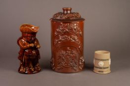NINETEENTH CENTURY MOULDED POTTERY ?SNUFF TAKER? TOBY JUG, in honey glaze, 9 ½? (24.cm) high,