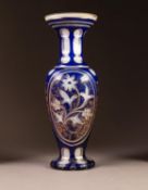 NINETEENTH CENTURY WHITE AND BLUE CASED AND FLASH CUT GLASS VASE, of ovoid form with waisted neck,