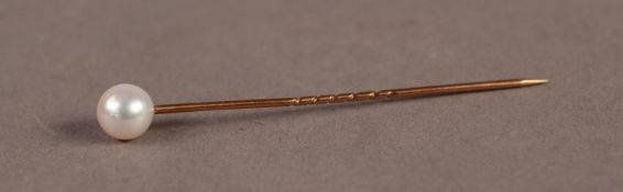 GOLD COLOURED METAL STICK PIN surmounted by a single pearl