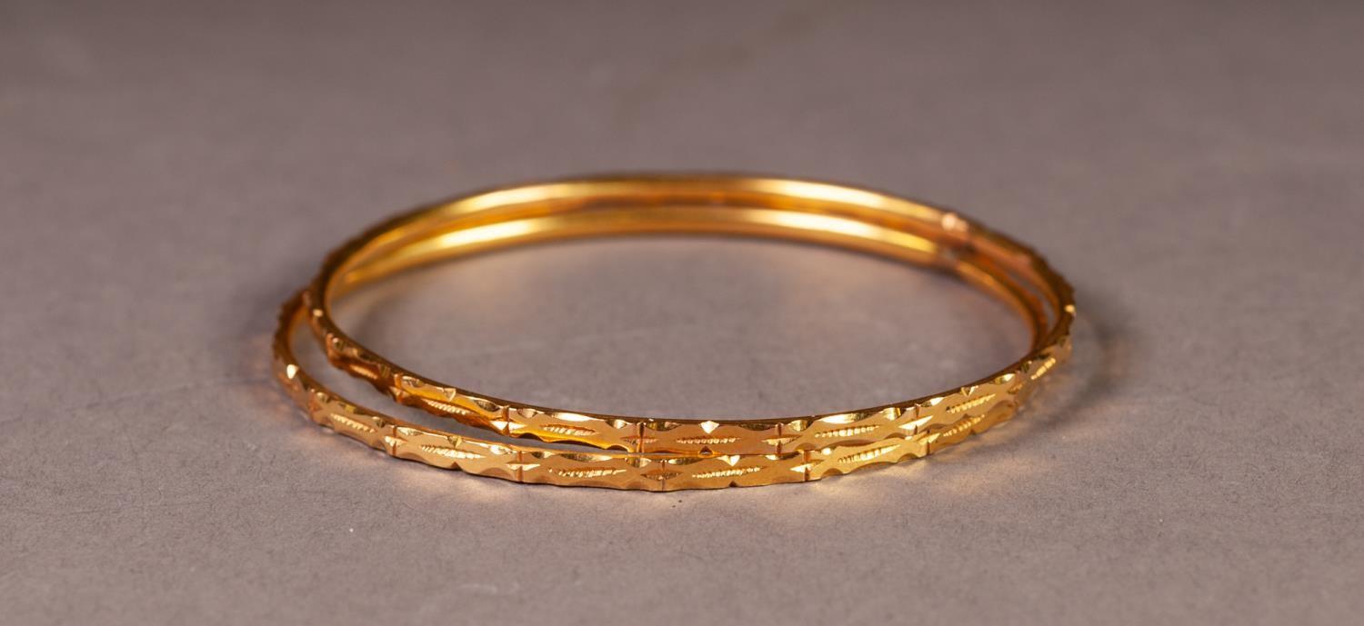 PAIR OF THIN BANGLES with chased decoration, 2 1/4" (5.7cm) diameter, 22.9gms