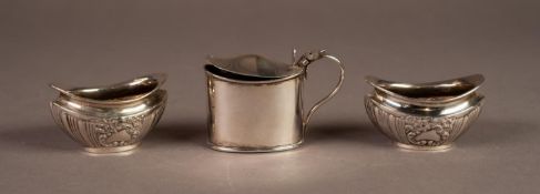 EDWARD VII PAIR OF EMBOSSED SILVER SMALL OPEN SALTS, each of part fluted oval form with foliate