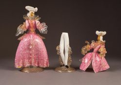 PAIR OF MURANO COLOURED GLASS FEMALE FIGURES, each modelled in mottled pink dress and white tri-corn