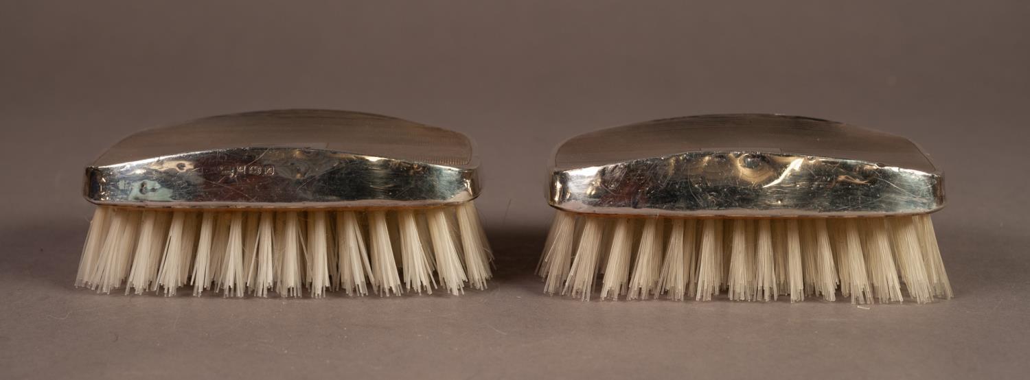 BOXED PAIR OF ENGINE TURNED FILLED SILVER BACKED MILITARY HAIR BRUSHES, Birmingham 1975