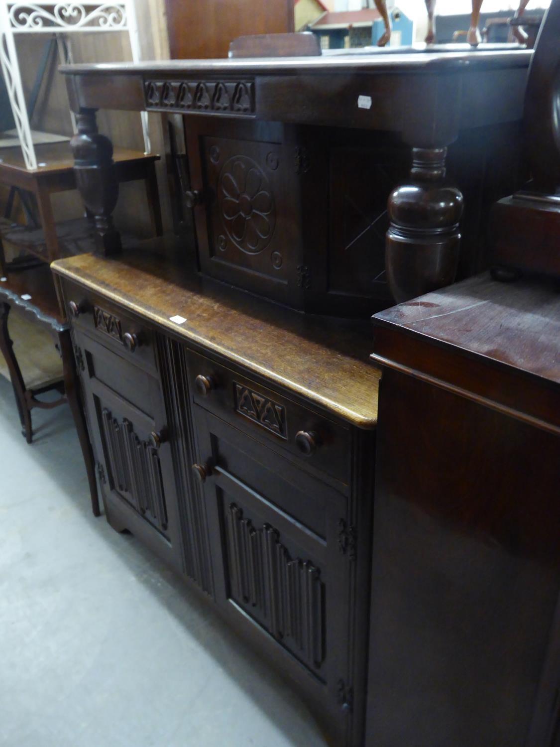 AN OAK JACOBEAN STYLE COURT CUPBOARD