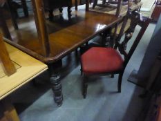 MAHOGANY DINING TABLE, ON TURNED SUPPORTS, THREE MAHOGANY DINING CHAIRS AND A LONG LOW COFFEE