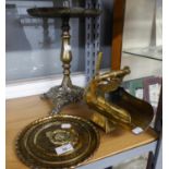 A BRASS PEDESTAL TRIVET STAND, A TRENCH ART COAL SCUTTLE AND A BRASS COMMEMORATIVE PLAQUE (3)