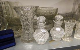 A LARGE COLLECTION OF CUT AND MOULDED GLASSWARES TO INCLUDE; BOWLS, VASES, DECANTERS ETC.....