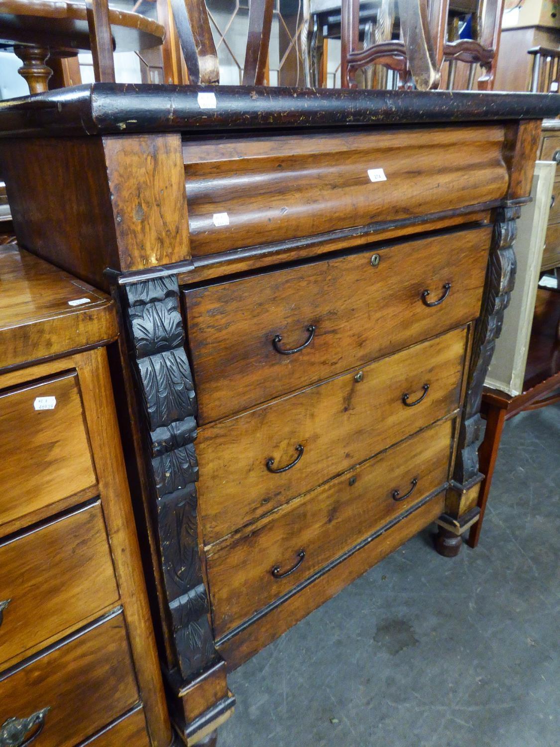 A TALL LATE VICTORIAN WALNUT CHEST OF DRAWERS WITH CARVED CORBELS AND OGEE TOP DRAWER