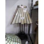 AN ART DECO STYLE BRONZE THREE COLUMN TABLE LAMP WITH OBLONG BASE AND THE LEADED AND MARBLED
