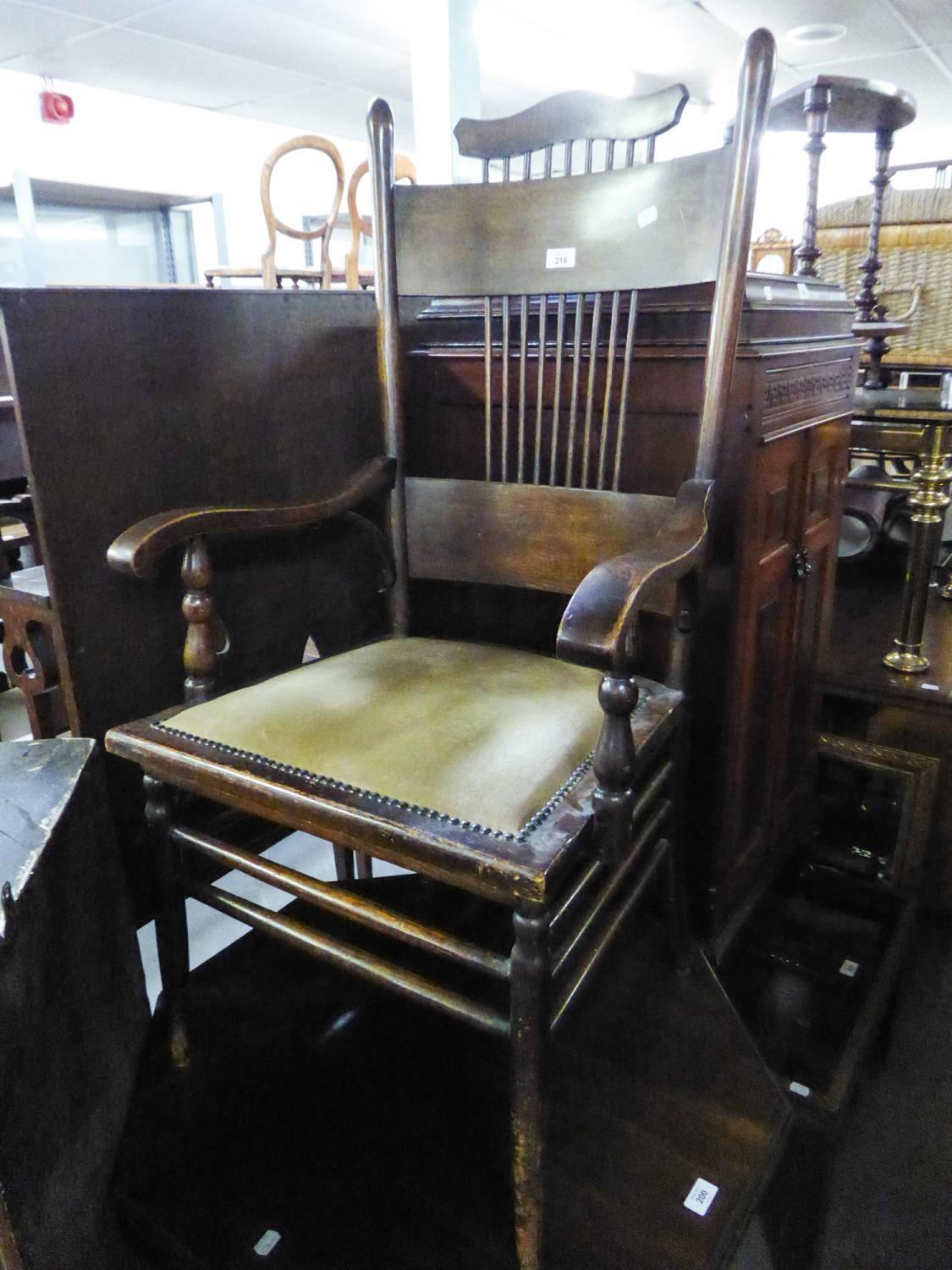 AN OAK ARTS AND CRAFTS ARMCHAIR, WITH SPIDLE AND PANEL BACK