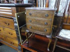 A THREE DRAWER BEDSIDE CABINET, A MODERN VERTICAL WALL MIRROR, AN ORIENTAL STYLE SQUARE TOP STAND