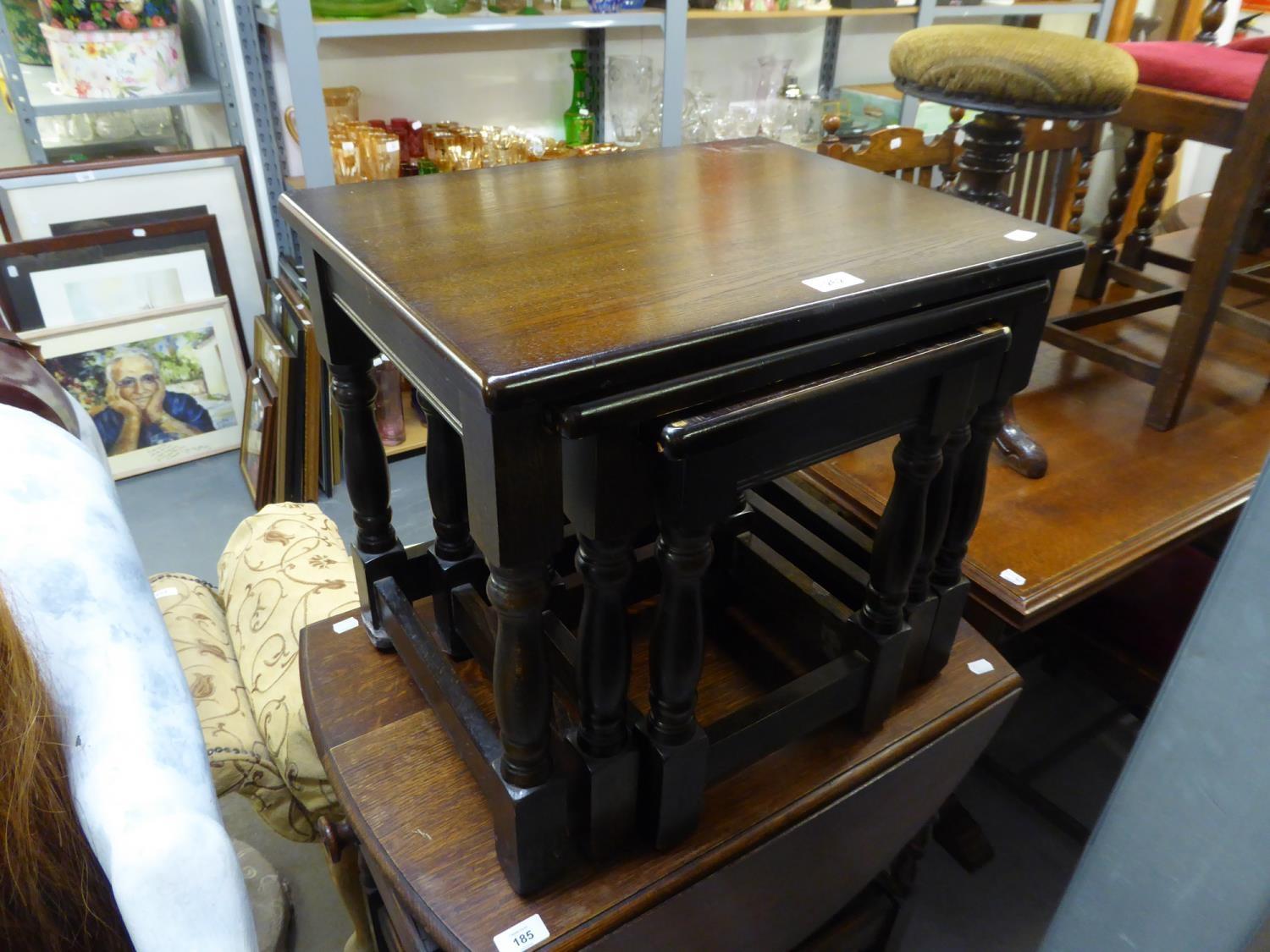 AN OAK NEST OF THREE OBLONG COFFEE TABLES