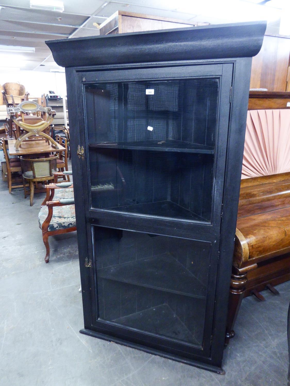 EARLY TWENTIETH CENTURY BLACK PAINTED HANGING DISPLAY CORNER CUPBOARD OF LARGE PROPORTIONS, THE