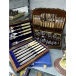 A MAHOGANY CASE CONTAINING SIX PAIRS OF DESSERT KNIVES AND FORKS WITH ELECTROPLATE BLADES AND BONE