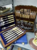 A MAHOGANY CASE CONTAINING SIX PAIRS OF DESSERT KNIVES AND FORKS WITH ELECTROPLATE BLADES AND BONE