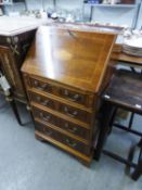 A REPRODUCTION YEWWOOD INLAID BUREAU, HAVING FOUR DRAWERS, LOOP HANDLES AND FITTED BUREAU SECTION