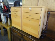 A PAIR OF LIGHT WOOD SMALL FILING CABINETS, WITH TWO SHALLOW DRAWERS OVER A DEEP FILING DRAWER,