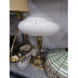 AN ART NOUVEAU STYLE FLORAL EMBOSSED CAST BRONZE TABLE LAMP WITH DOMED OPAQUE WHITE GLASS SHADE