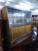 TEAK BOOKCASE HAVING GLASS SLIDING DOORS TO THE TOP AND CUPBOARD DOORS BELOW