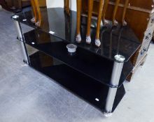 A MODERN BRASS AND GLASS TOP COFFEE TABLE AND A GLASS THREE TIER TV/HI-FI STAND (2)