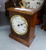 KNIGHT AND GIBBINS, LONDON, BATTERY OPERATED SMALL MANTEL CLOCK IN MAHOGANY CASE WITH BRASS CARRYING