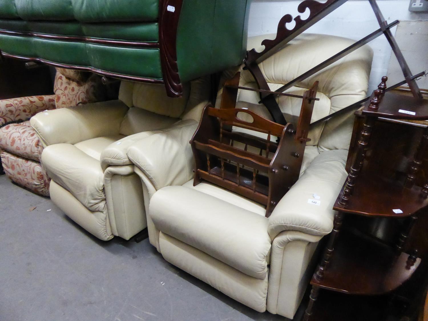 PAIR OF CREAM LEATHER LOUNGE CHAIRS WITH EXTENDING LEG RESTS AND REVOLVING ACTION