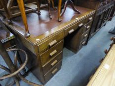 1950's/60's OAK KNEEHOLE DESK HAVING LEATHER INSET  TOP, HAVING 9 DRAWERS